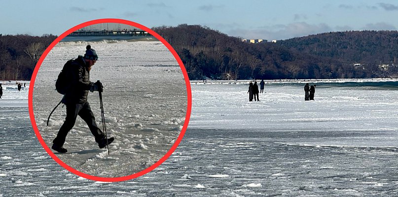 Cienki lód, a ludzie wchodzą w głąb morza przy plaży w Sopocie [WIDEO]